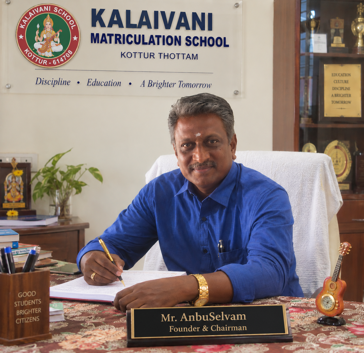 Chairperson Anbuselvam at school administrative office desk
